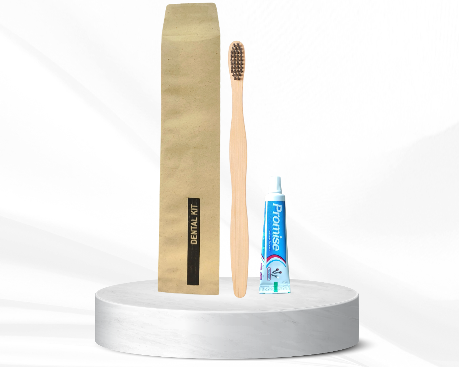 Dental kit with bamboo toothbrush, dental floss, and toothpaste on a white platform with 'ecomfd' branding.